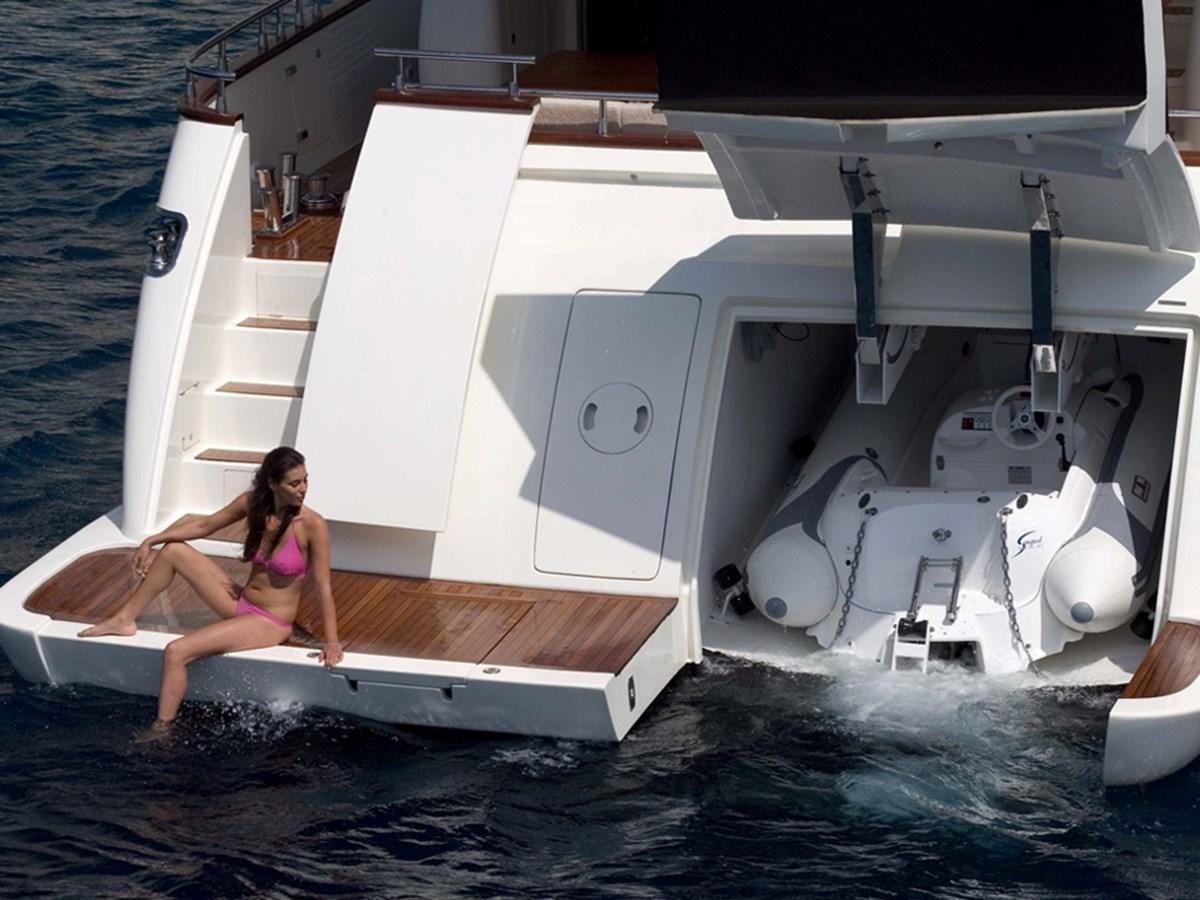 a person jumping into a boat aboard HABANO Yacht for Sale