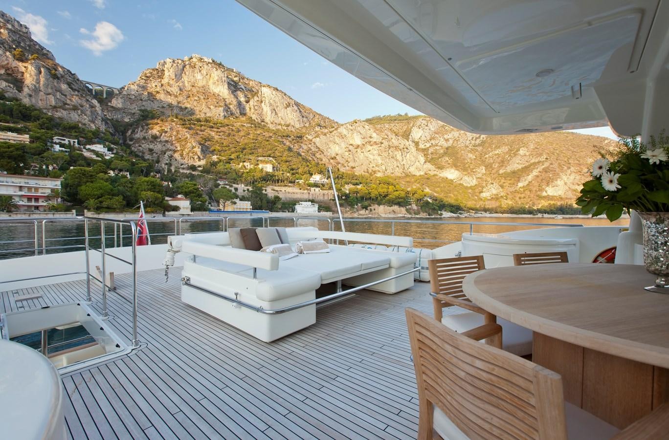 a large white boat on a deck aboard LA PAUSA Yacht for Sale