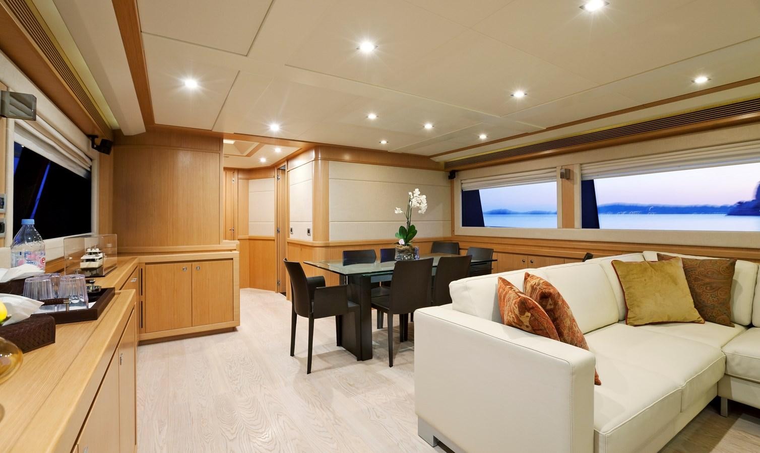 a living room with a couch and a table aboard LA PAUSA Yacht for Sale