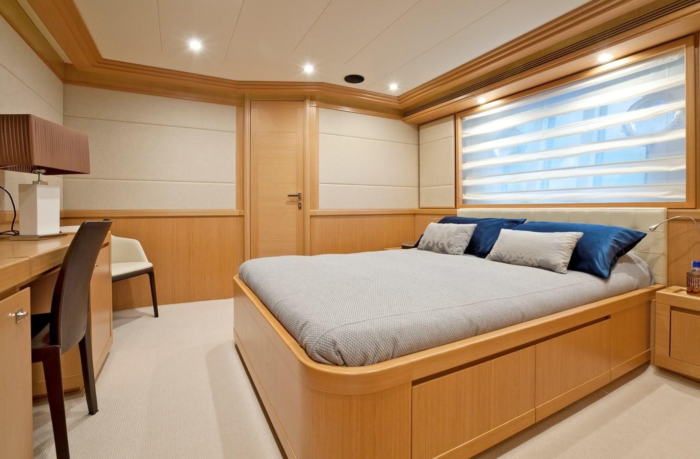 a large bed in a room aboard LA PAUSA Yacht for Sale