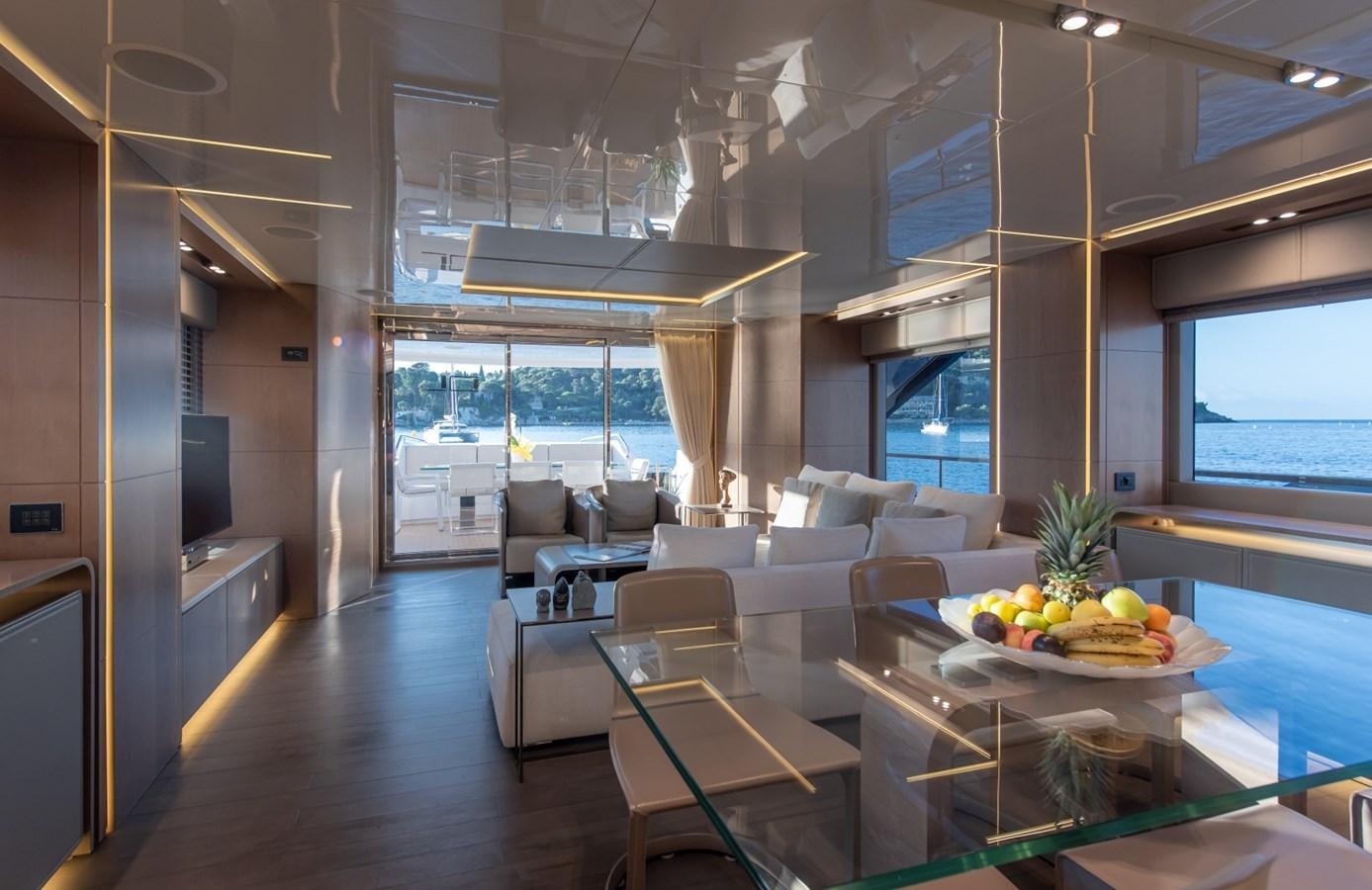 a large room with a table and chairs aboard 7 SECONDS Yacht for Sale