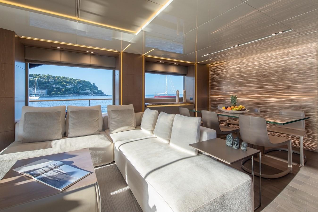 a living room with a couch and a table aboard 7 SECONDS Yacht for Sale
