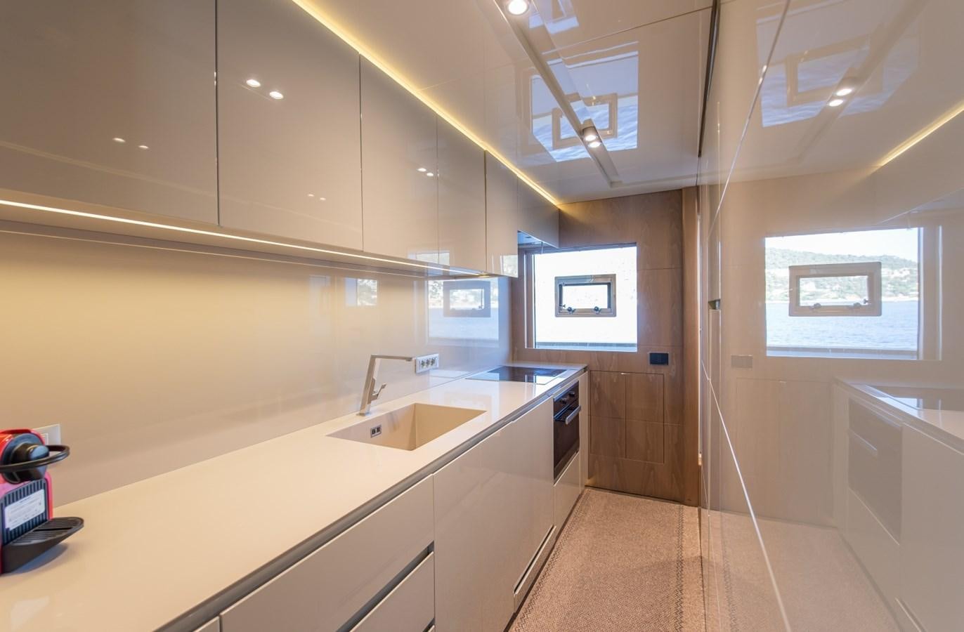 a kitchen with a sink and a window aboard 7 SECONDS Yacht for Sale