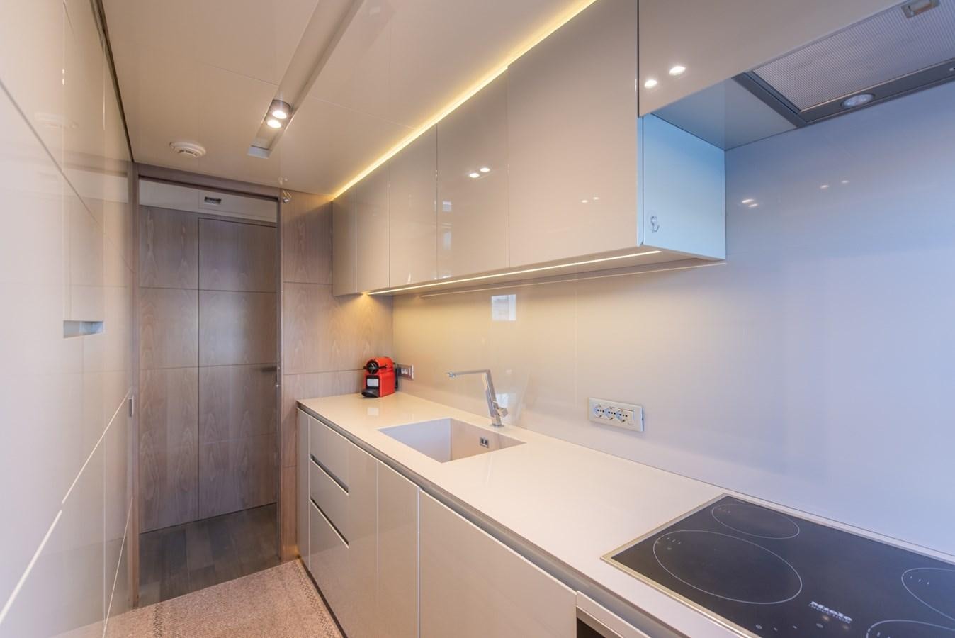 a kitchen with a sink and cabinets aboard 7 SECONDS Yacht for Sale