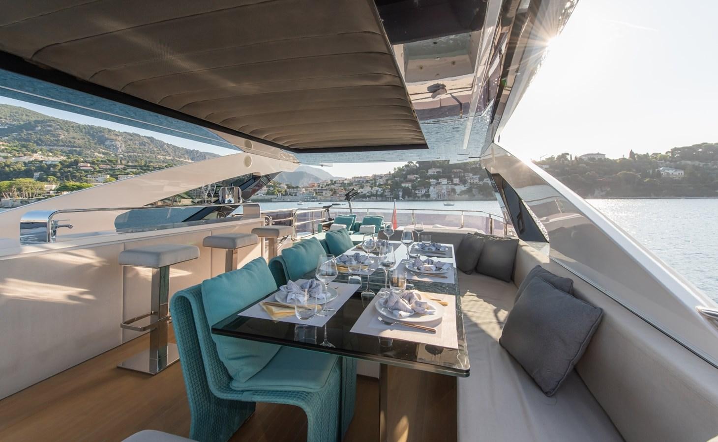 a table with chairs on it aboard 7 SECONDS Yacht for Sale