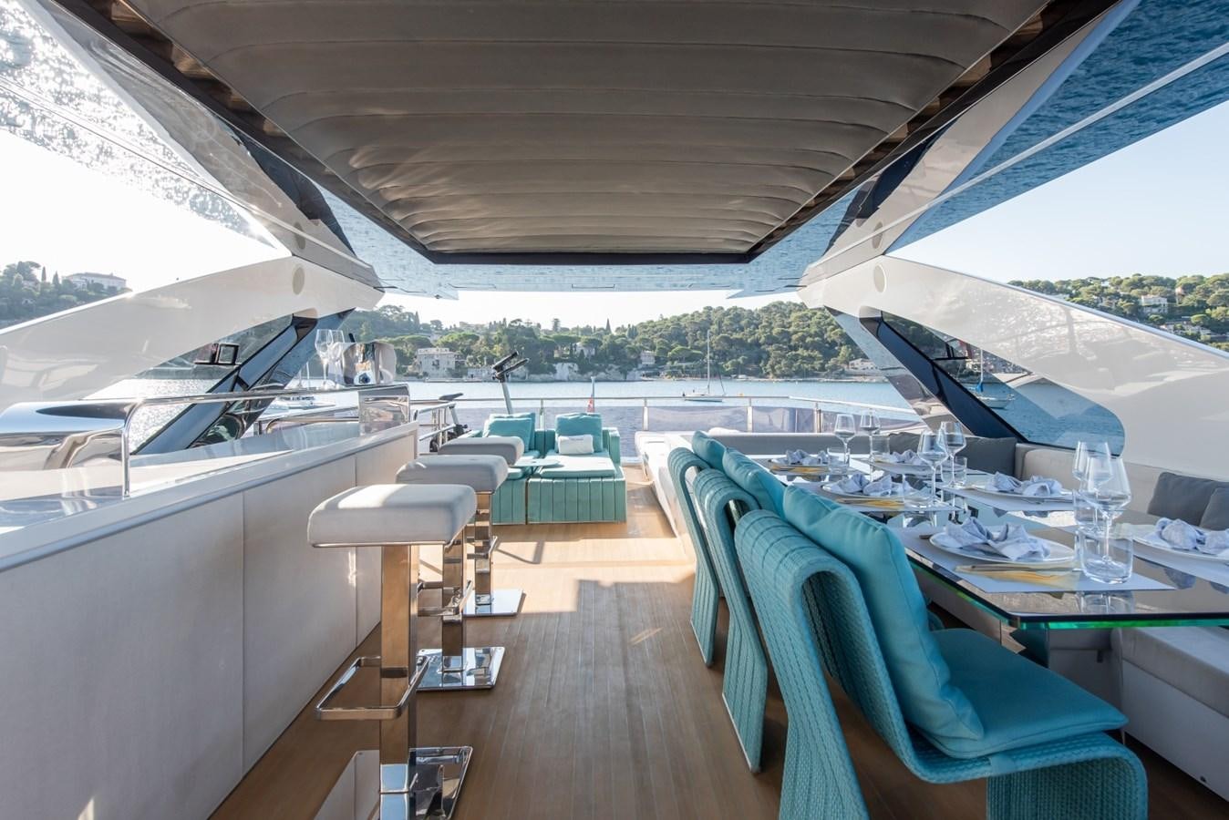 a large open space with a deck and a view of the water aboard 7 SECONDS Yacht for Sale