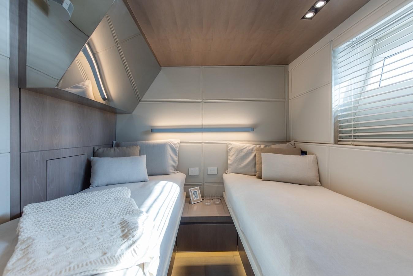 a room with two beds aboard 7 SECONDS Yacht for Sale