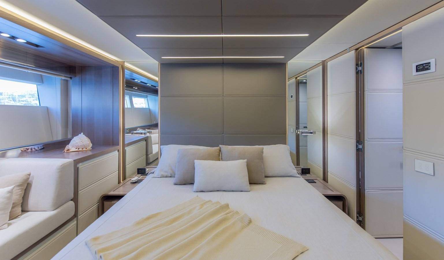 a room with a bed and a desk aboard 7 SECONDS Yacht for Sale