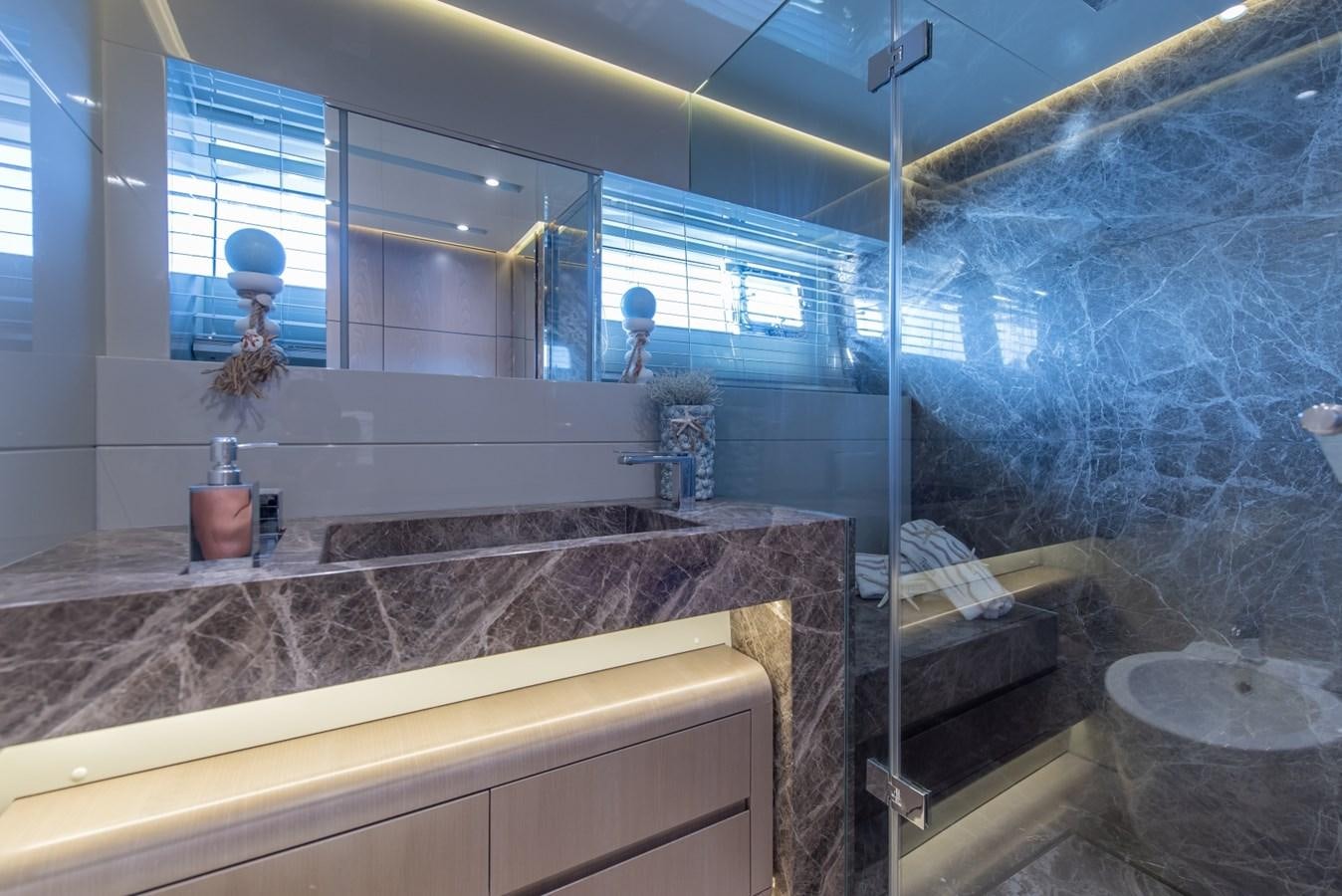 a bathroom with a large glass shower aboard 7 SECONDS Yacht for Sale