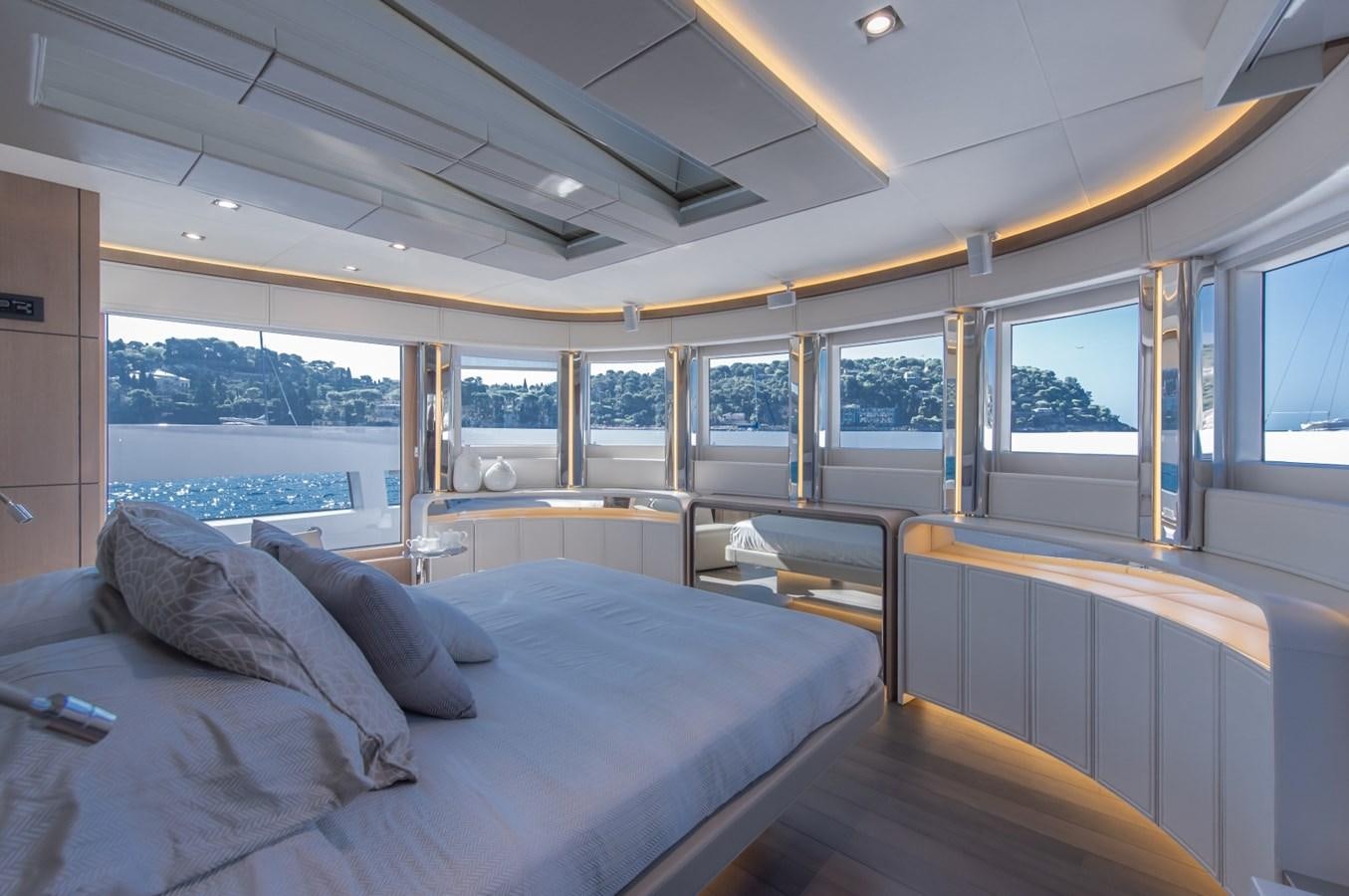 a room with a bed and a window aboard 7 SECONDS Yacht for Sale
