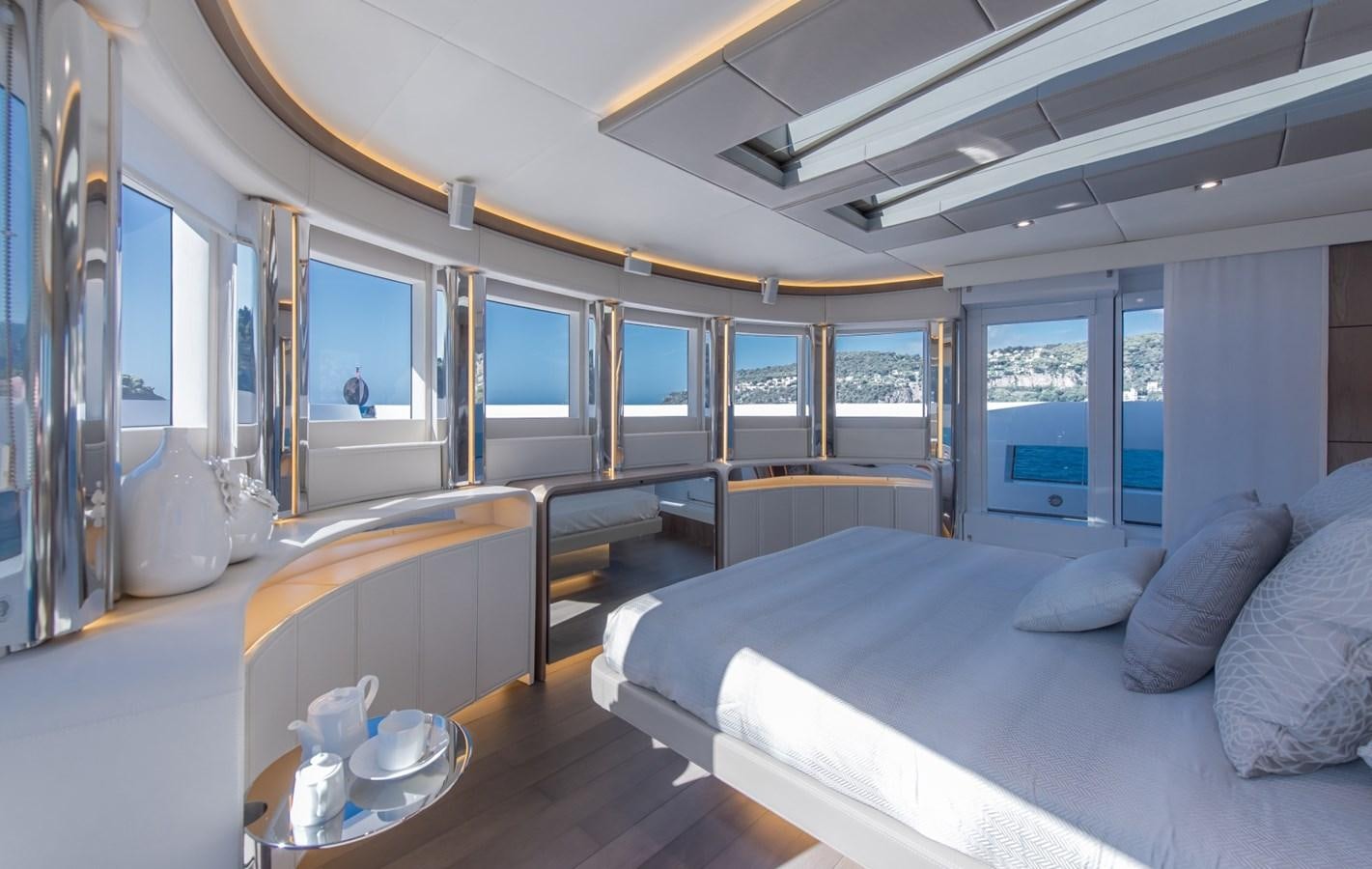 a room with a bed and a table aboard 7 SECONDS Yacht for Sale
