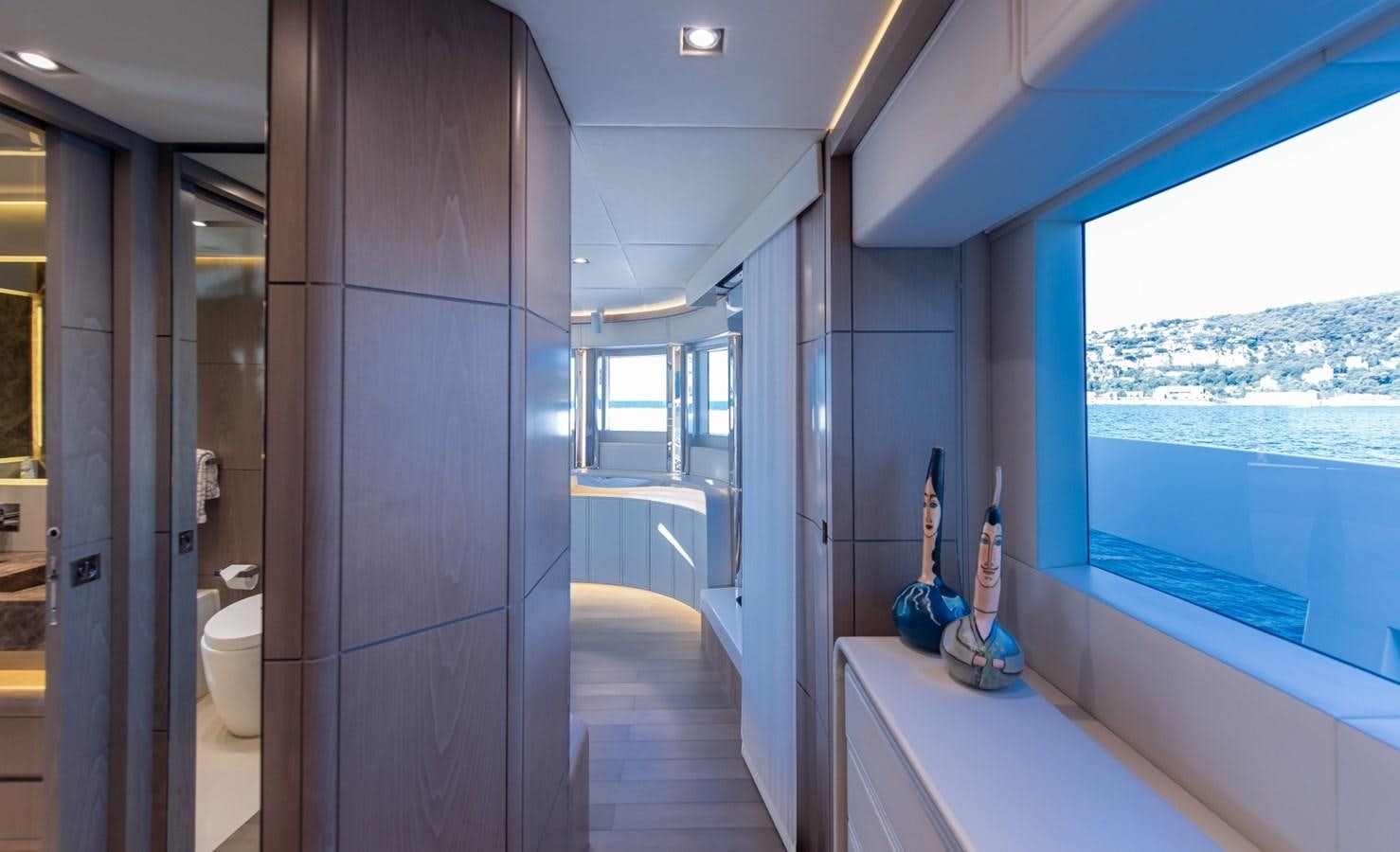a bathroom with a blue wall aboard 7 SECONDS Yacht for Sale