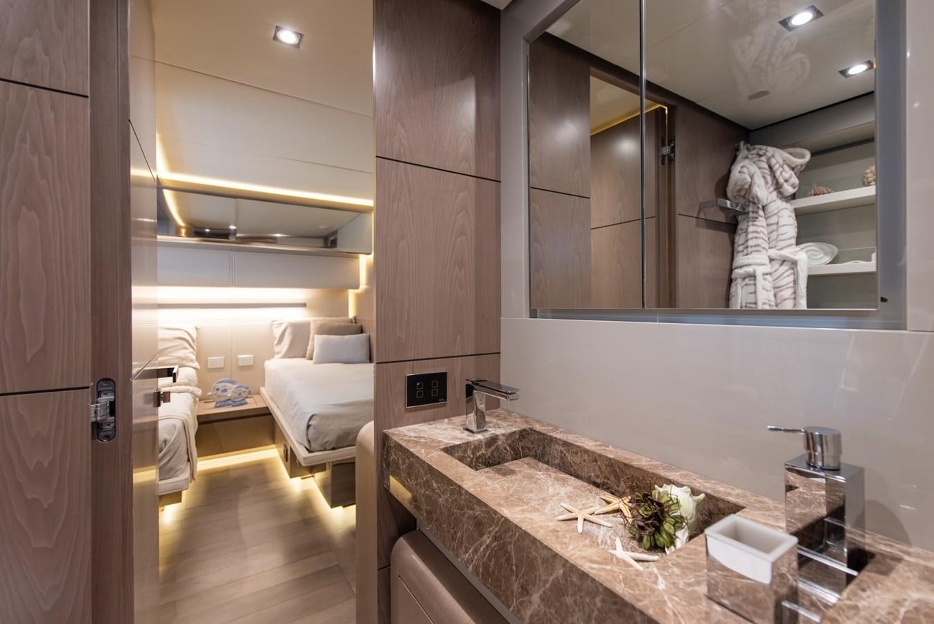 a bathroom with a countertop sink and a mirror aboard 7 SECONDS Yacht for Sale