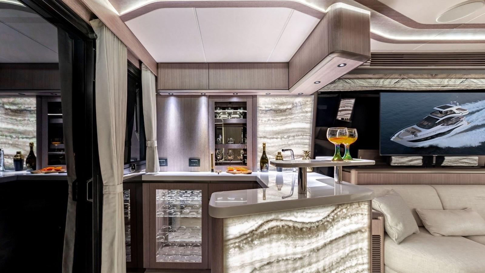 a room with a table and chairs aboard GALEON 800 FLY/1 Yacht for Sale