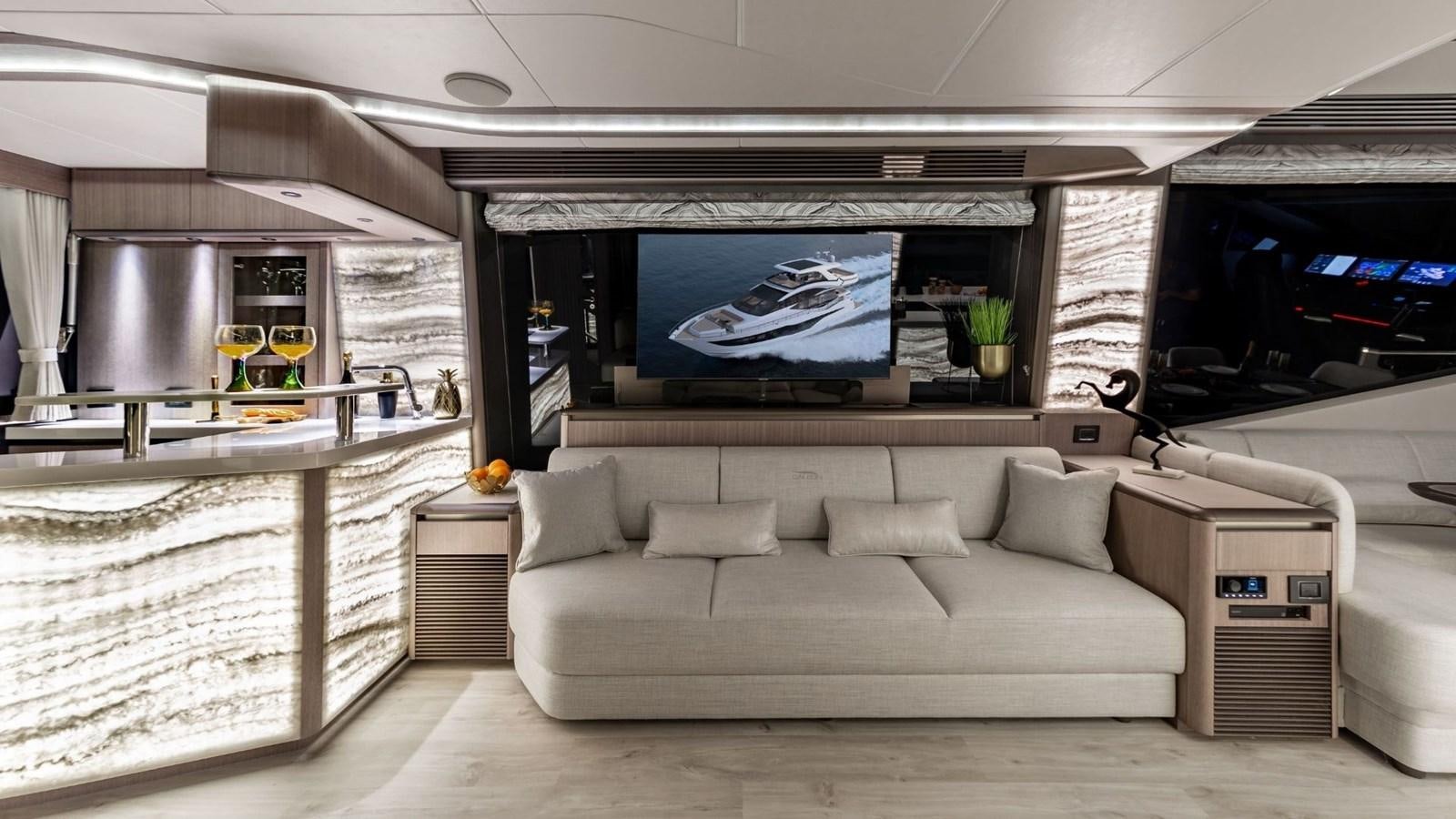 a living room with a large screen aboard GALEON 800 FLY/1 Yacht for Sale