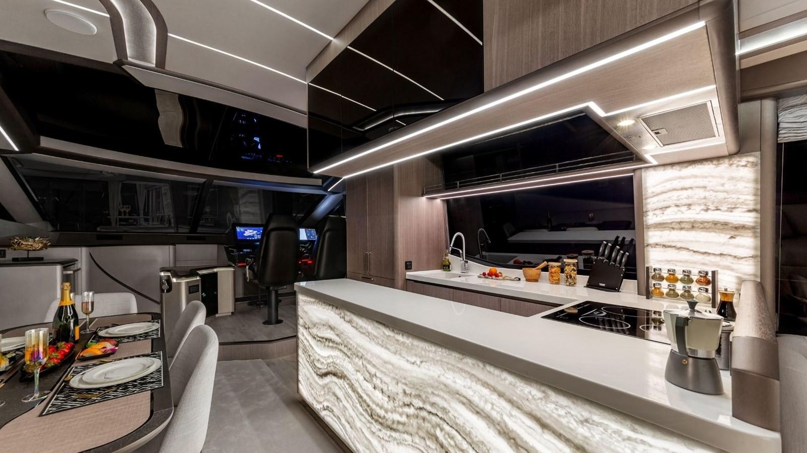 a kitchen with a large island aboard GALEON 800 FLY/1 Yacht for Sale