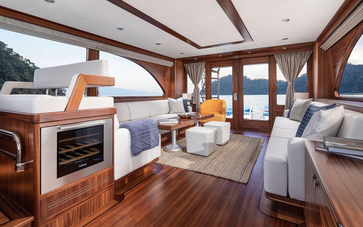 a living room with a fireplace aboard ALECTO Yacht for Sale