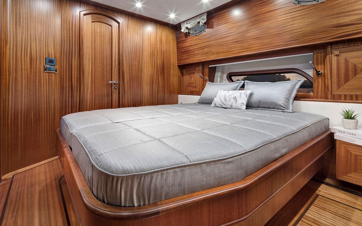 a bed in a room aboard ALECTO Yacht for Sale