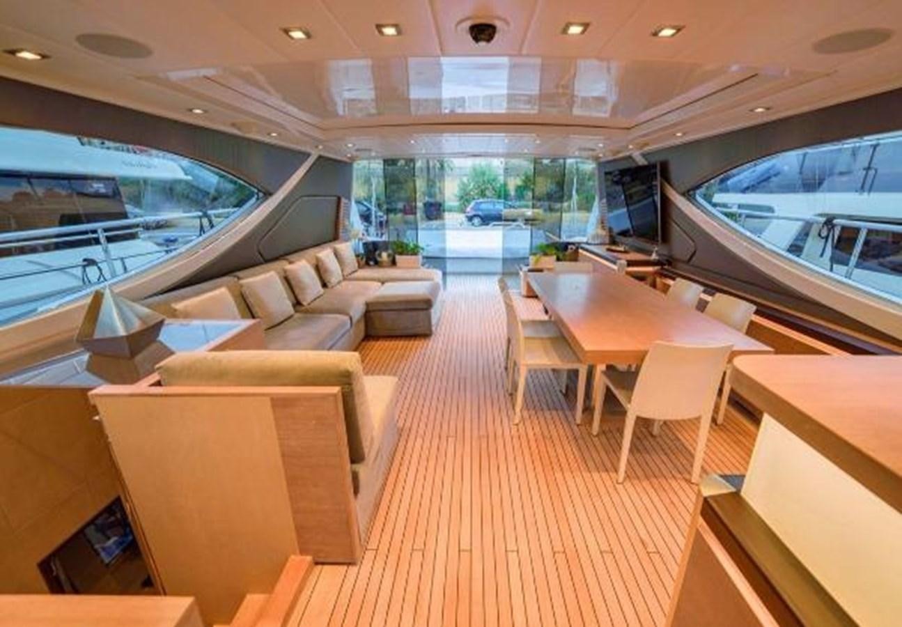a room with a couch and a table and chairs aboard @LAST Yacht for Sale