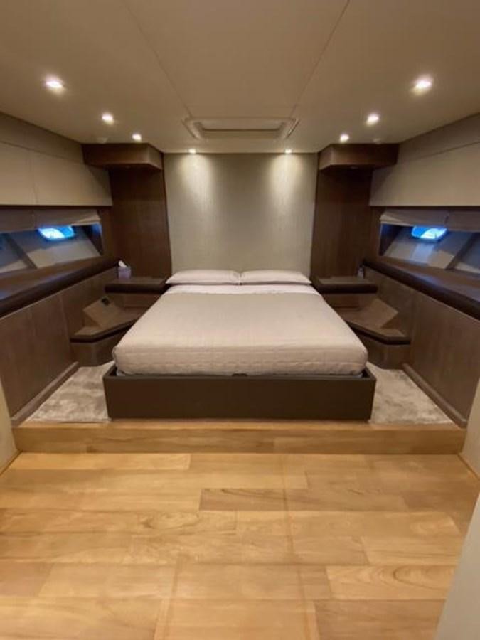 a room with a bed and a desk aboard @LAST Yacht for Sale