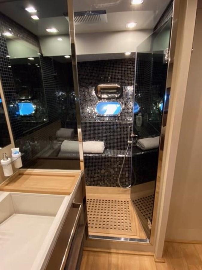 a bathroom with a large glass shower aboard @LAST Yacht for Sale