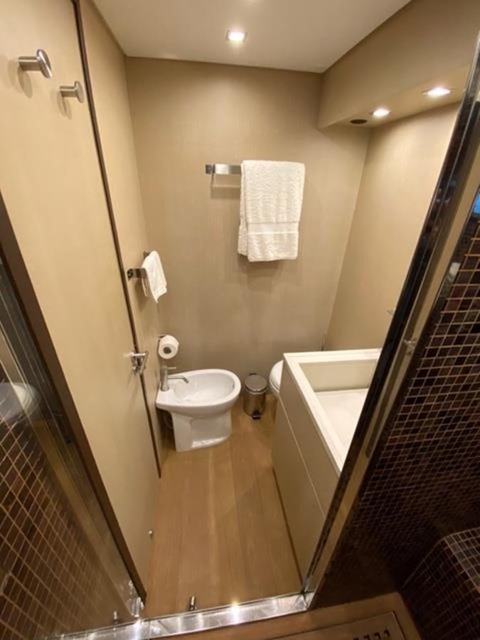 a bathroom with a toilet and a sink aboard @LAST Yacht for Sale