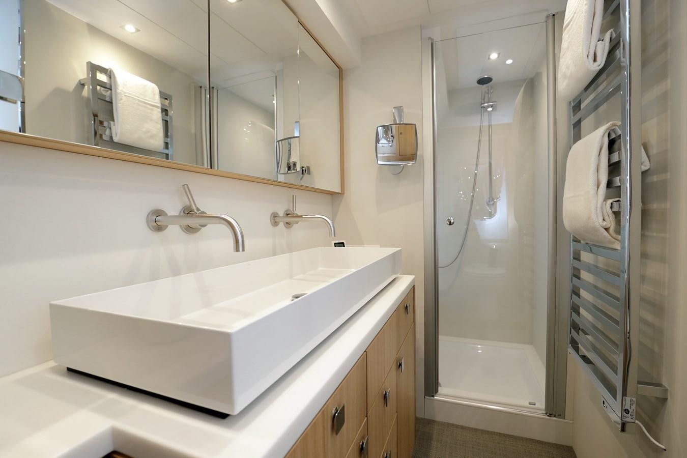 a bathroom with a large mirror aboard ARMONEE Yacht for Sale
