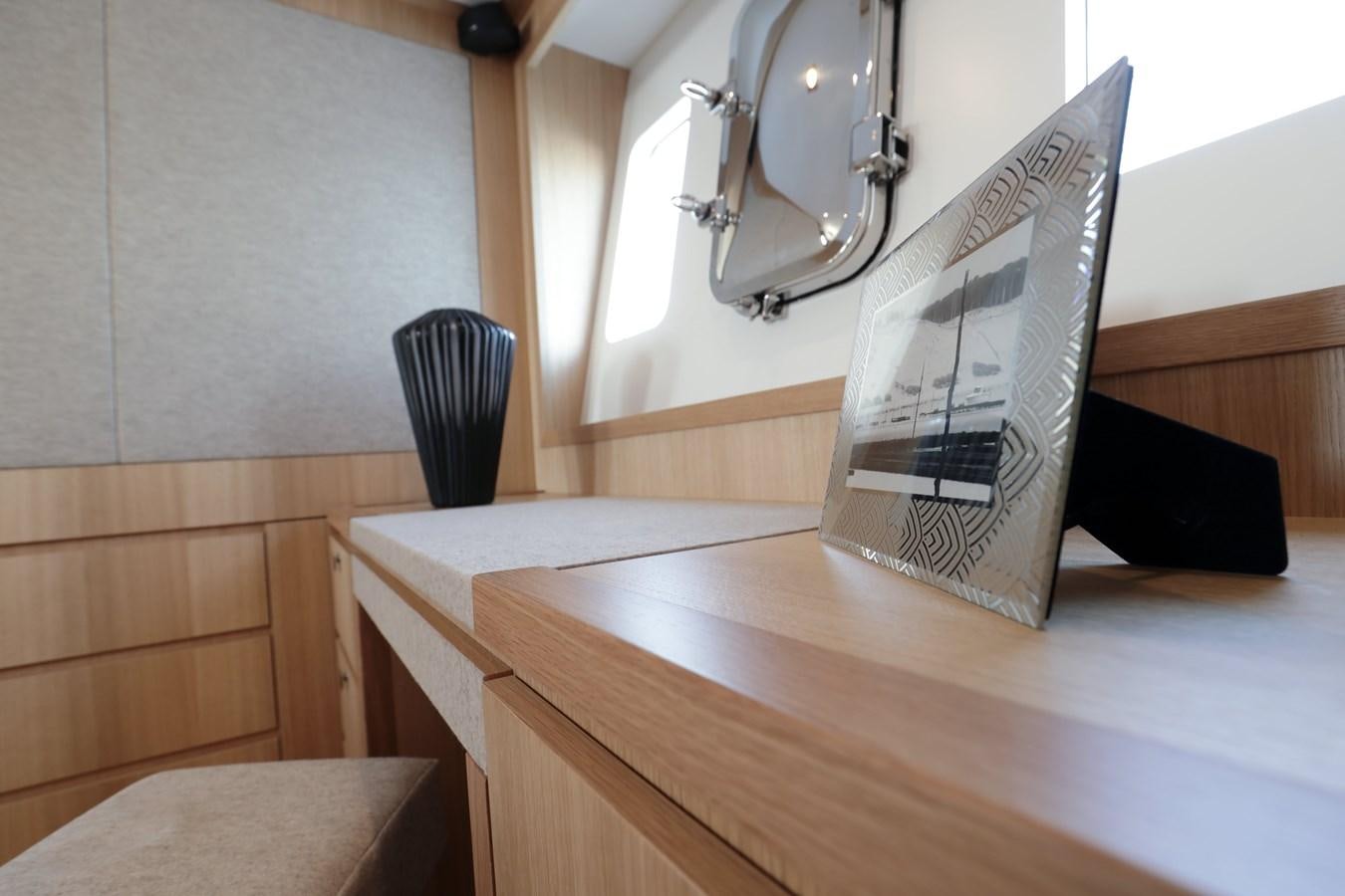 a book on a table aboard ARMONEE Yacht for Sale