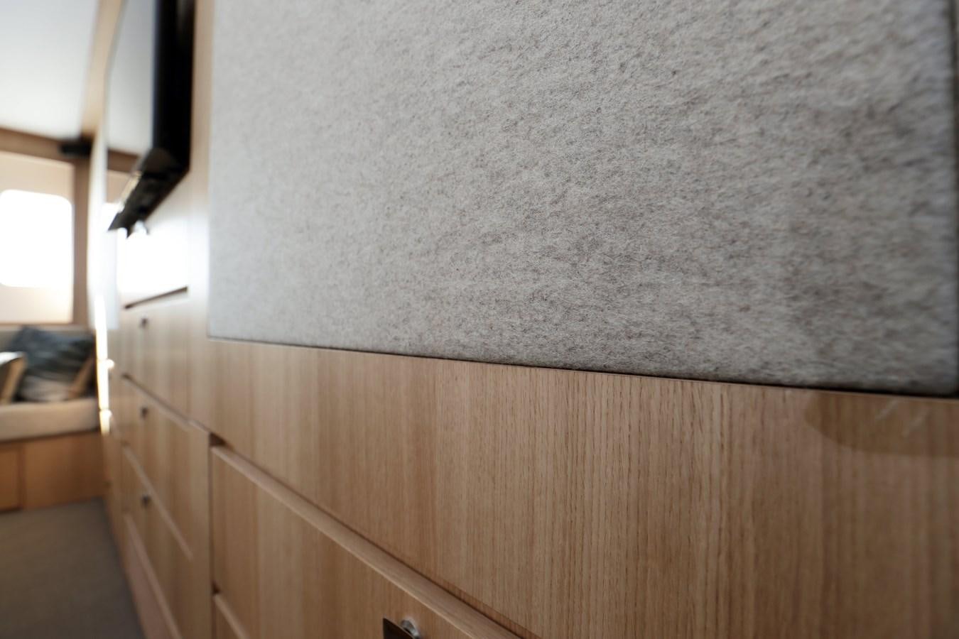 a white wall with a black object on it aboard ARMONEE Yacht for Sale