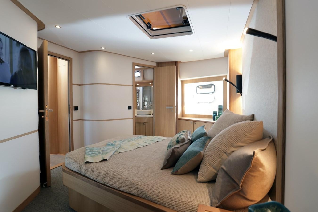 a bed in a room aboard ARMONEE Yacht for Sale