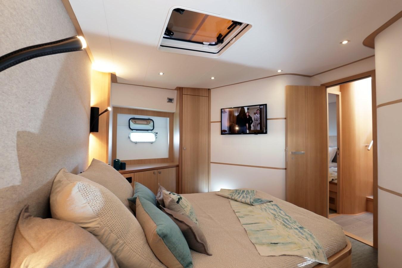 a bed in a room aboard ARMONEE Yacht for Sale