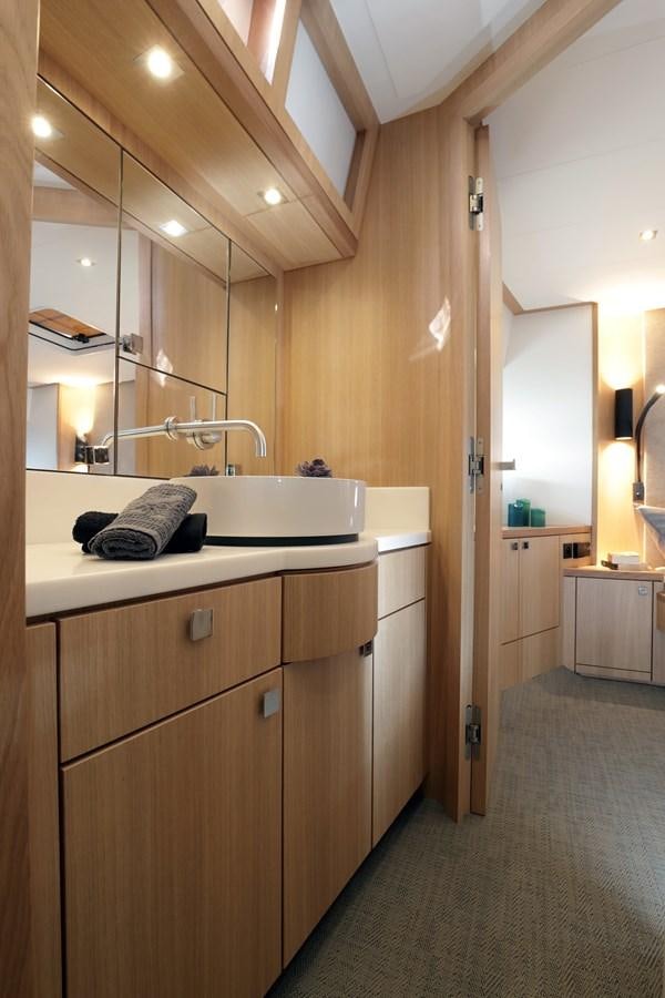a bathroom with a sink and a mirror aboard ARMONEE Yacht for Sale