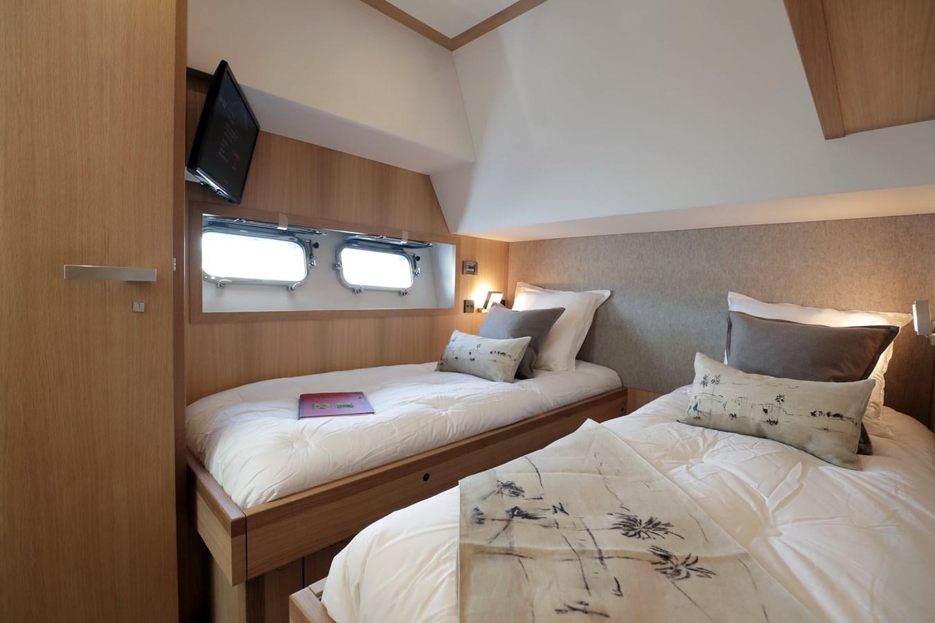 a room with two beds aboard ARMONEE Yacht for Sale
