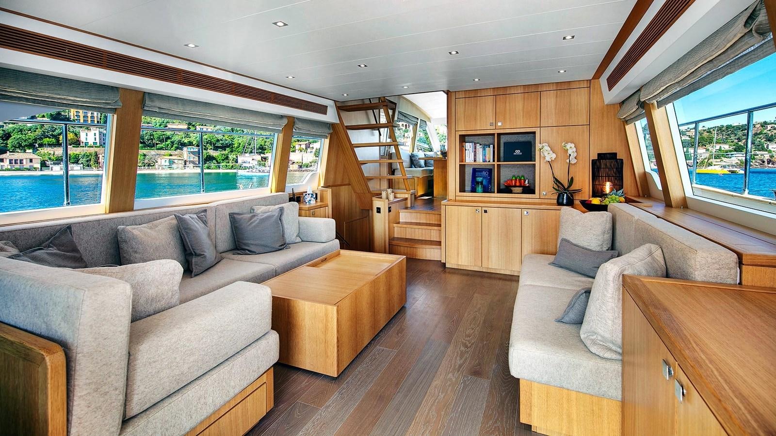 a living room with a large window aboard ARMONEE Yacht for Sale