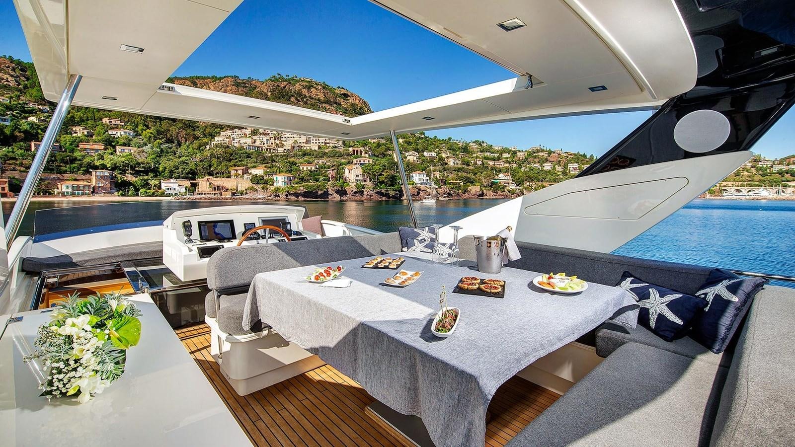 a table with food on it aboard ARMONEE Yacht for Sale