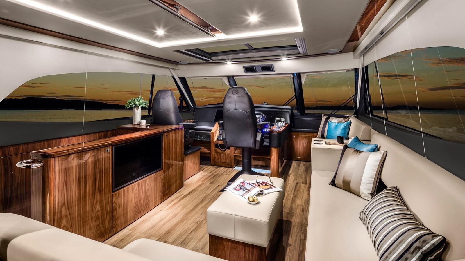 a room with a tv and a table aboard 68 SPORTS MOTOR YACHT Yacht for Sale