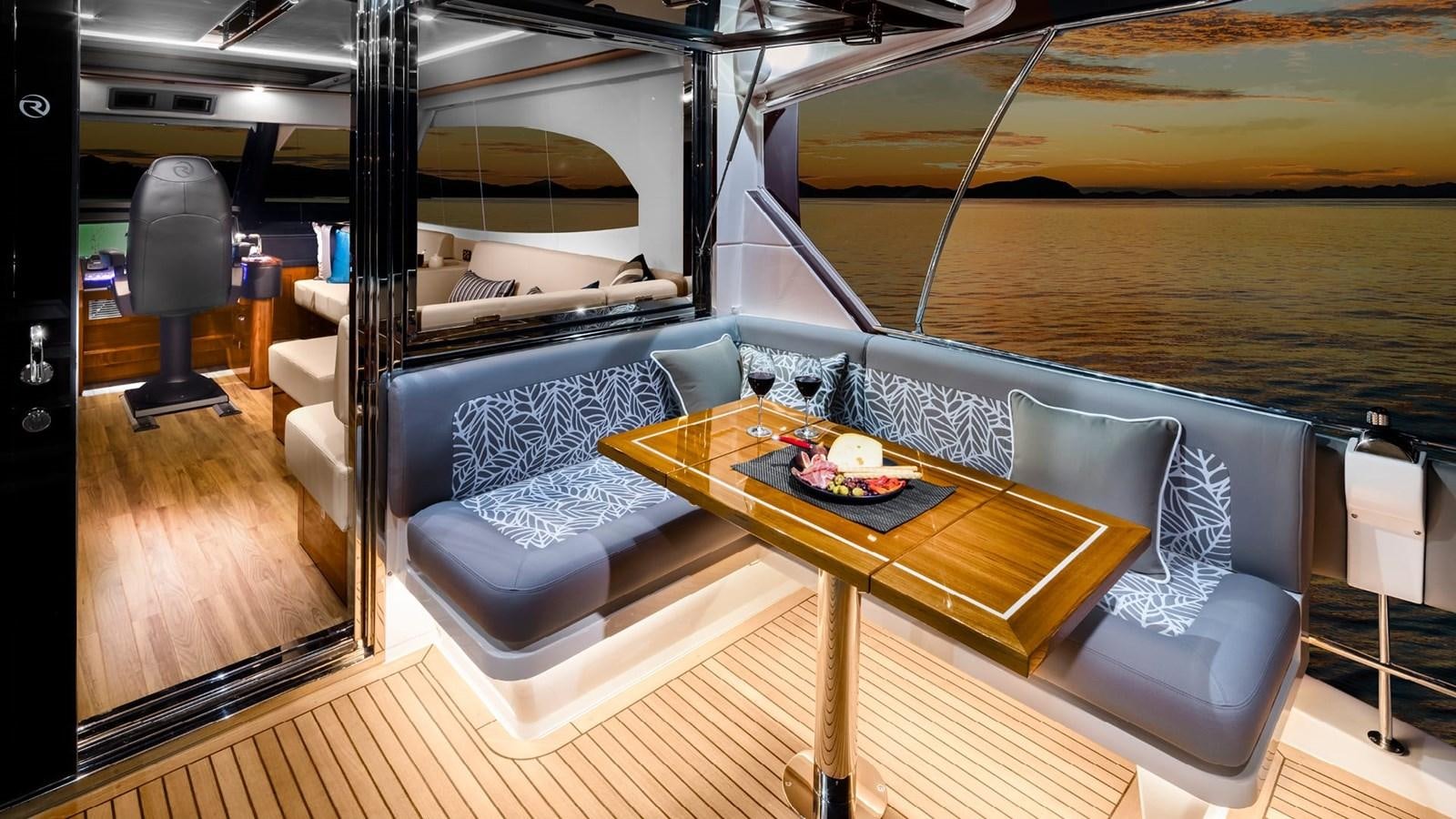 a room with a couch and a table aboard 68 SPORTS MOTOR YACHT Yacht for Sale