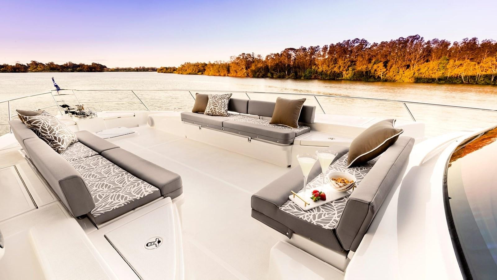 a white car with a convertible top and a seat on the front aboard 68 SPORTS MOTOR YACHT Yacht for Sale