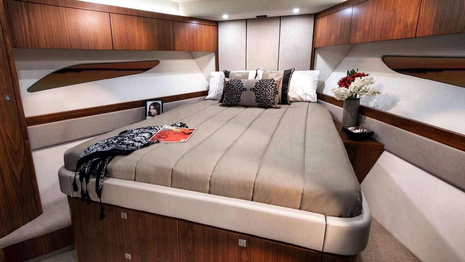 a bed with a flower vase aboard 68 SPORTS MOTOR YACHT Yacht for Sale