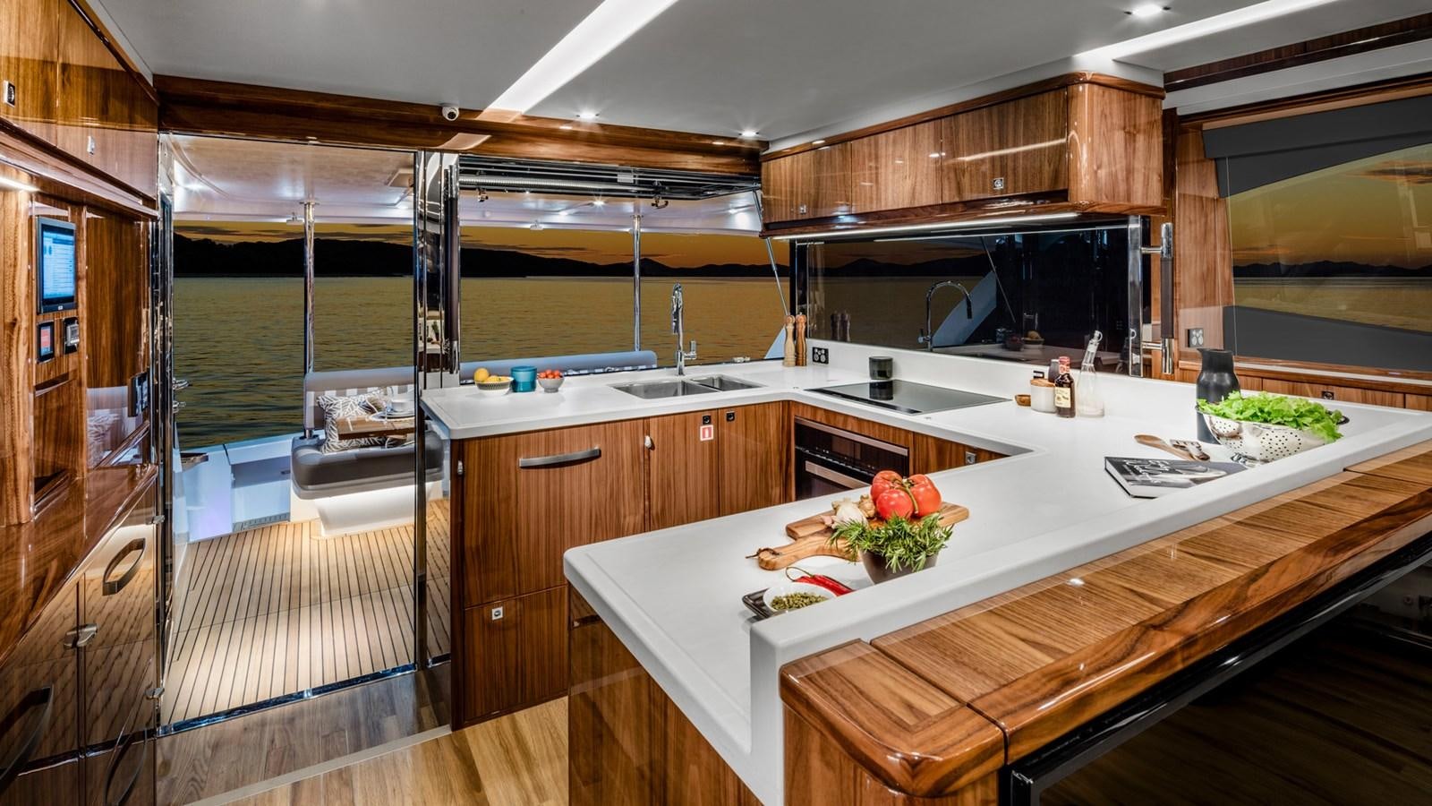 a kitchen with a large island aboard 68 SPORTS MOTOR YACHT Yacht for Sale