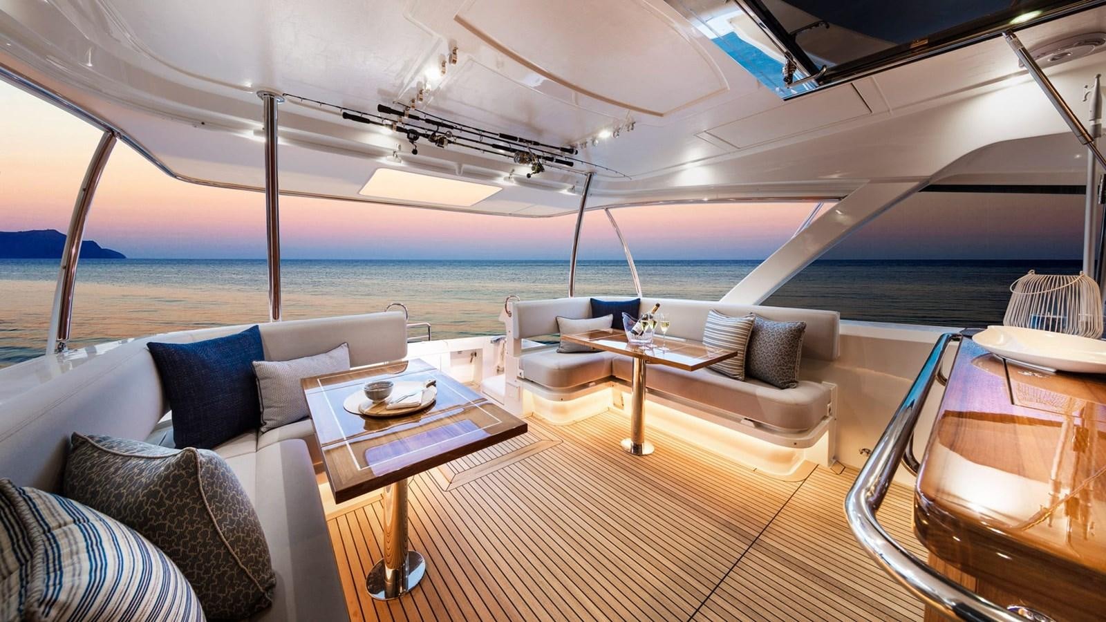 a large white tent with a couch and a table and chairs aboard 68 SPORTS MOTOR YACHT Yacht for Sale