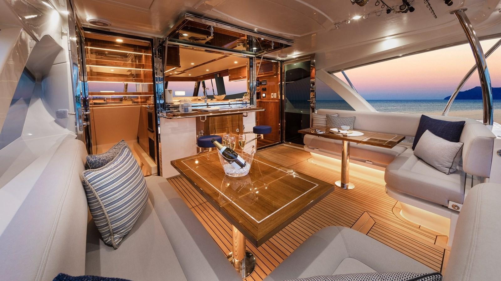 a room with a table and chairs aboard 68 SPORTS MOTOR YACHT Yacht for Sale