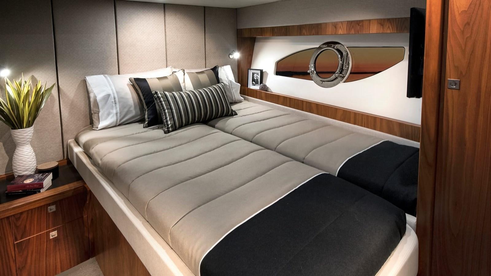 a bed with a white bed spread aboard 68 SPORTS MOTOR YACHT Yacht for Sale