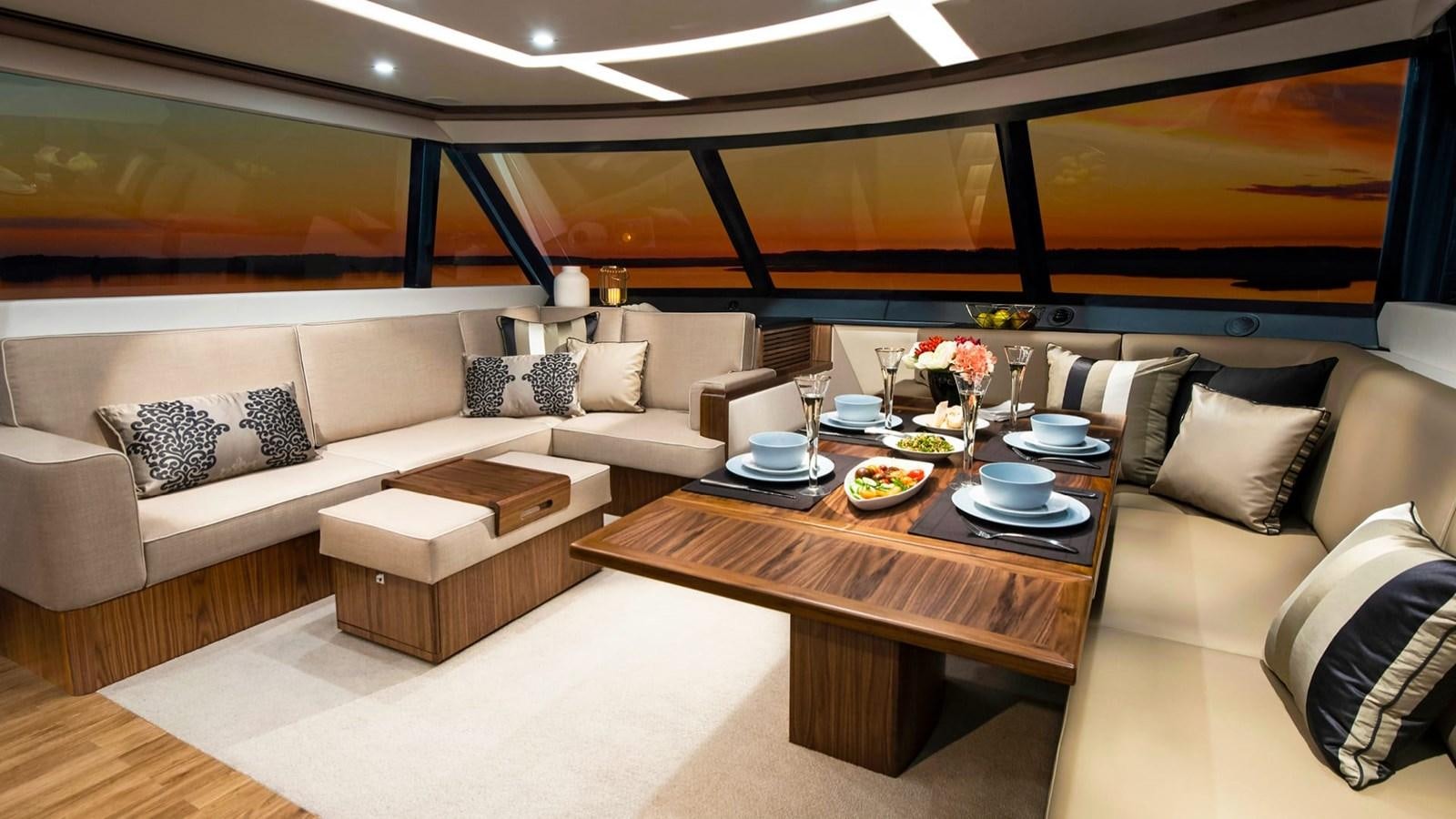 a living room with a couch and a table aboard 68 SPORTS MOTOR YACHT Yacht for Sale