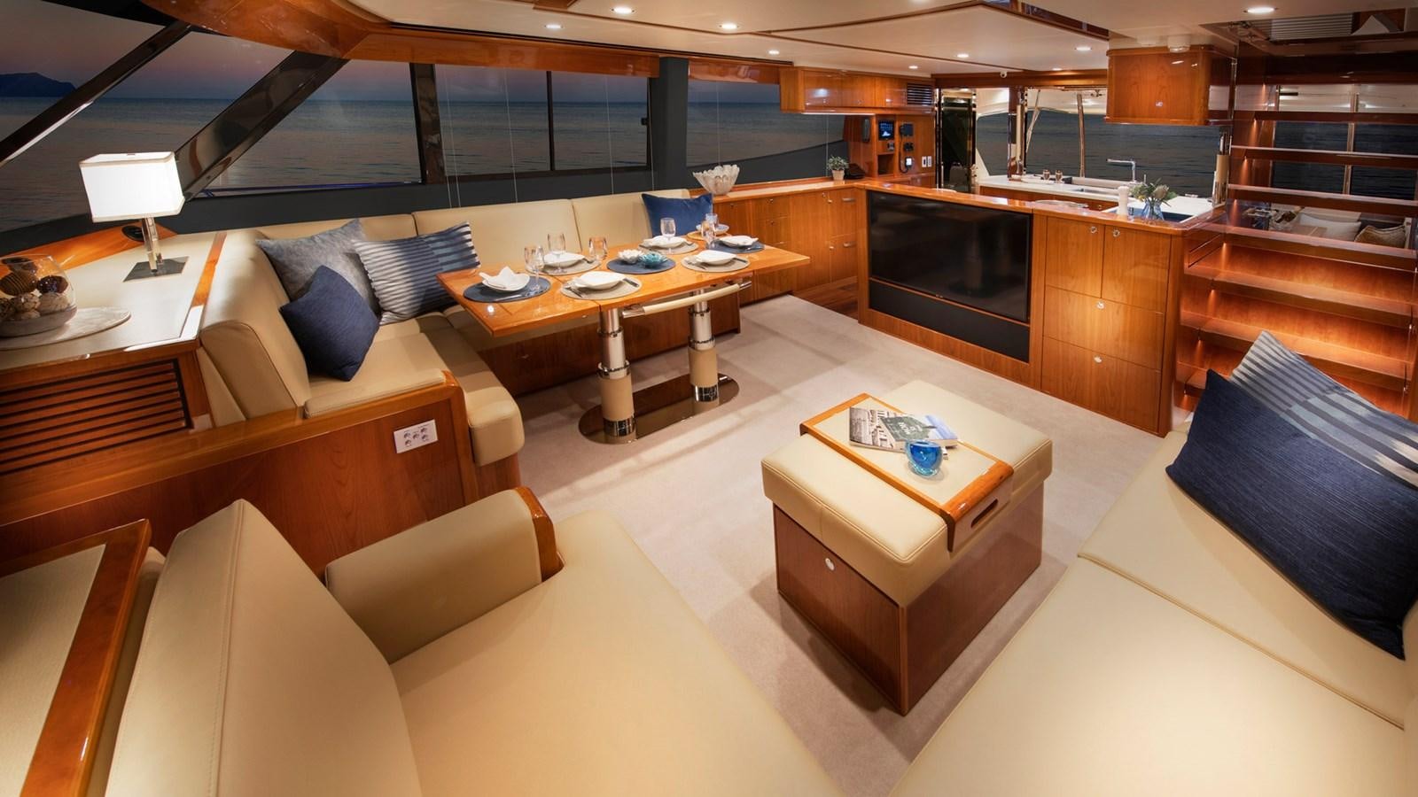 a room with a couch and a table aboard 68 SPORTS MOTOR YACHT Yacht for Sale