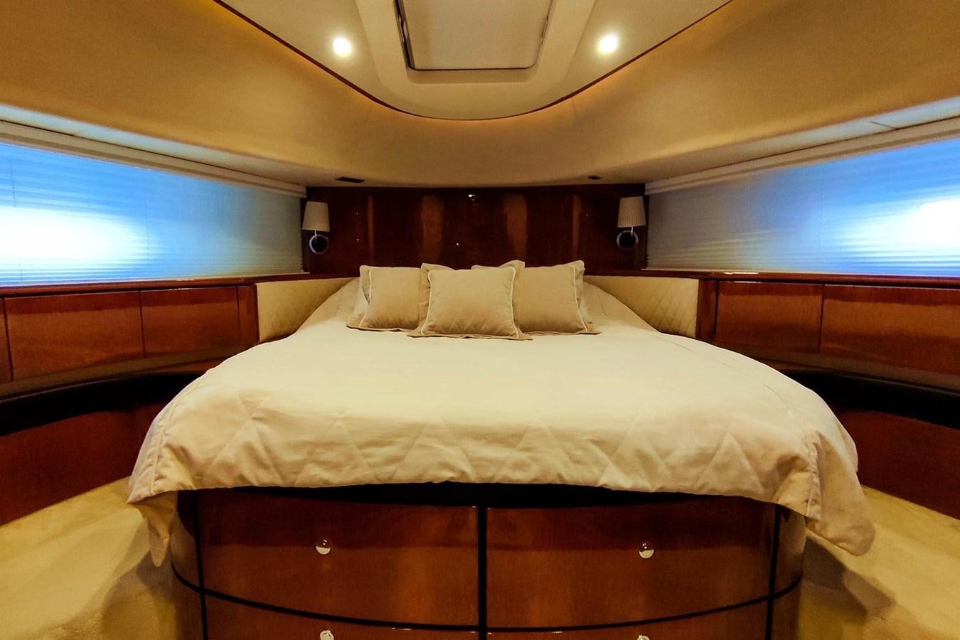 a bed with white sheets aboard SEVEN Yacht for Sale