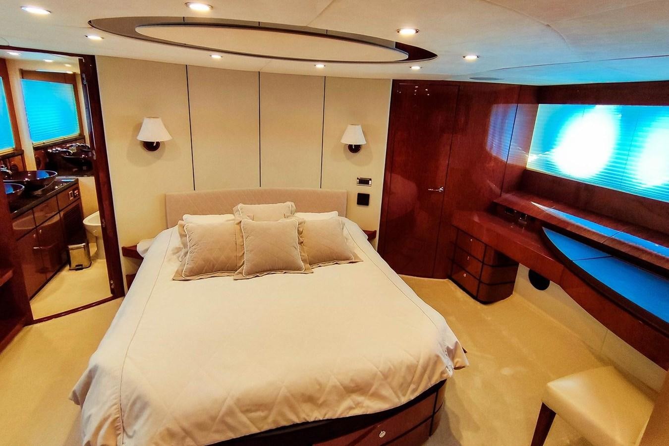 a hotel room with a bed and tv aboard SEVEN Yacht for Sale