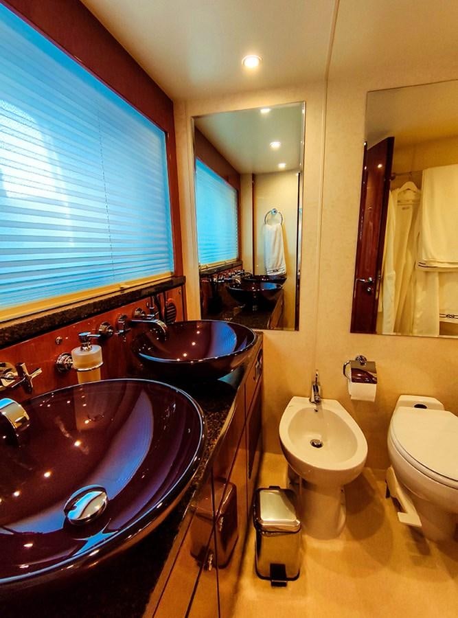 a bathroom with a sink and a toilet aboard SEVEN Yacht for Sale