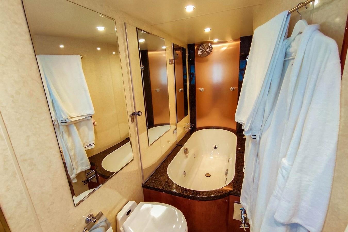 a bathroom with a bathtub and a sink aboard SEVEN Yacht for Sale
