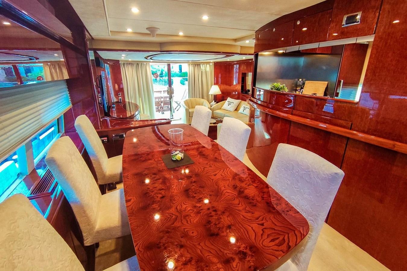 a large room with a table and chairs aboard SEVEN Yacht for Sale